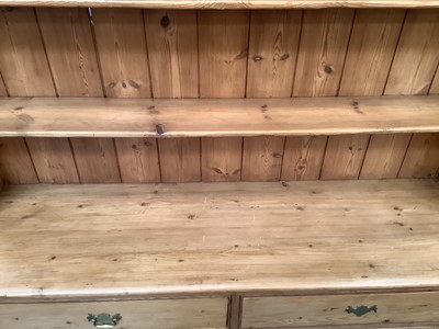 Lot 964 - Antique pine two height kitchen dresser with shelves above and two short and two long drawers