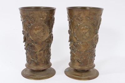 Lot 747 - Pair of 19th century cylindrical bronze goblets with floral decoration