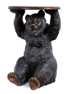 Lot 734 - Late 19th / early 20th century Black Forest carved linden wood bear occasional table