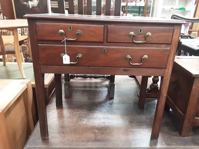 Lot 871 - George III mahogany mahogany lowboy with two short and one long drawer with brass swan neck handles on moulded square chamfered legs