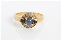 Lot 3281 - Sapphire and diamond ring with a central...