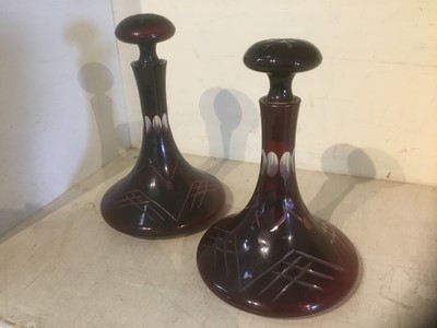 Lot 191 - Pair of antique purple cut glass ships decanters and stoppers