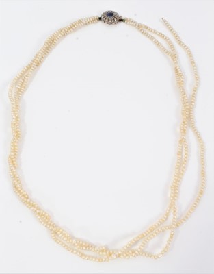Lot 546 - Three row seed pearl necklace with sapphire and diamond clasp in original box (one string broken)