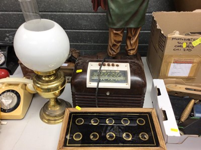 Lot 267 - Early 20th century servants' bell box, together with a Bush Bakelite radio and a brass oil lamp (3)