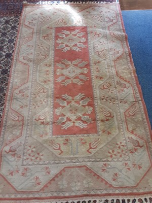 Lot 1025 - Rug with geometric decoration beige and peach ground, 217cm x 121cm