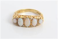Lot 3220 - Gold (18ct) five stone opal ring interspaced...