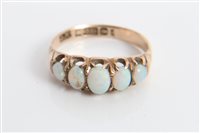 Lot 3223 - Gold (9ct) five stone opal ring in claw...