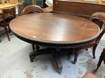 Lot 1040 - Late 19th century carved oak oval dining table on turned supports