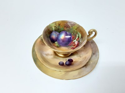 Lot 1144 - Good quality Royal Worcester fruit painted cup and saucer trio