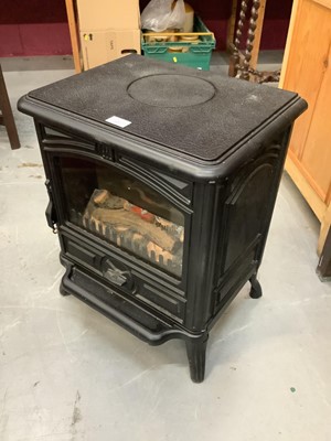 Lot 897 - Modern electric heater in the form of a wood burner