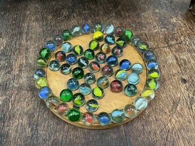 Lot 10 - Vintage solitaire board and a collection of marbles