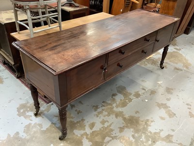 Lot 919 - George IV mahogany sideboard with two drawers flanked by twin cupboards, on turned legs and brass castors 
Provenance: Removed from Argyll House, Kings Road, London