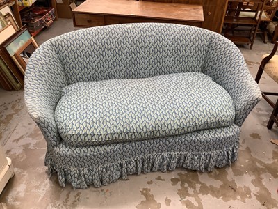 Lot 921 - Victorian-style kidney shaped two seater sofa upholstered in leaf patterned fabric on blue ground