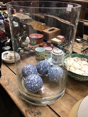 Lot 27 - Very large glass cylindrical vase containing four decorative spherical orbs