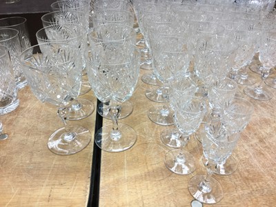 Lot 272 - Comprehensive suite of Webb Crystal cut glass table wares comprising claret jug, x2 decanters, fruit bowl, x11 water glasses, x12 red wine glasses, x12 white wine glasses, x11 finger bowls, x12 Des...