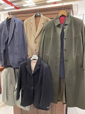 Lot 38 - Collection of vintage and other clothing to include a black hunting coat, leather riding boots, fur coat, various gentlemans suits, ladies green loden coat, vintage wedding dress and other jackets