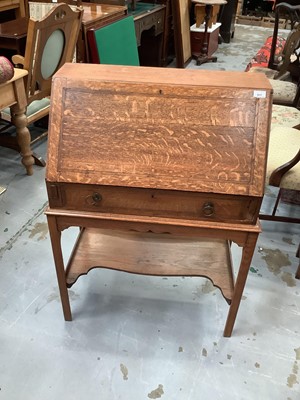 Lot 917 - Edwardian oak bureau with drawer on stand 73 cm wide and oak narrow bookcase 56 cm wide (2)