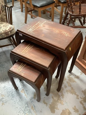 Lot 961 - Nest of three Oriental hardwood occasional tables with chinoiserie decoration