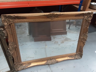 Lot 972 - Bevelled wall mirror in ornate gilt frame, 91cm x 68cm and one other smaller mirror (2)