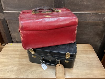 Lot 157 - 1950s black leather vanity case with most original fittings and gilt coronet and initials for the Marchioness of Normanby, together with an Edwardian red leather Pittway Bros. vanity case with appl...