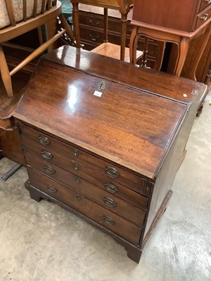 Lot 1002 - Georgian oak bureau with fitted interior and four long graduated drawers below on bracket feet, 83.5cm wide, 49cm deep, 95cm high