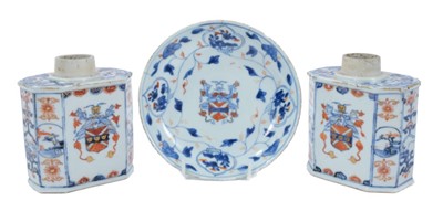 Lot 142 - Pair of early 18th century Kangxi Chinese Imari armorial tea canisters and saucer (3)