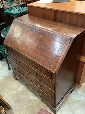 Lot 1025 - Georgian oak bureau with fitted interior and four long graduated drawers below on bracket feet, 99cm wide, 54cm deep, 109cm high