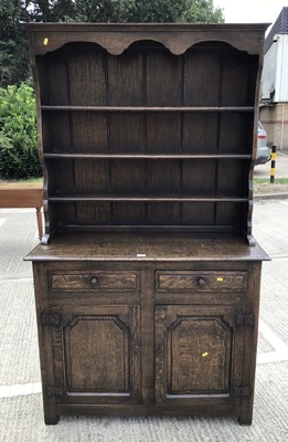 Lot 1033 - Good quality oak two height dresser with shelves above, two drawers and two panelled doors below, 109cm wide, 46cm deep, 185cm high ^