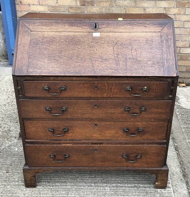 Lot 1034 - Georgian oak bureau with fitted interior and four long graduated drawers below, 90cm wide, 47cm deep, 105cm high