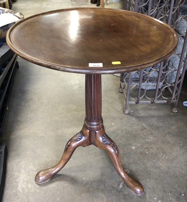 Lot 1036 - Good quality mahogany wine table with circular tilt top on fluted turned column and three hipped splayed legs, 60cm diameter