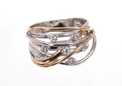 Lot 1973 - Diamond and two-colour gold ‘basket’ ring with white and yellow gold woven design scattered with six claw-set brilliant cut diamonds. Finger size approximately S.