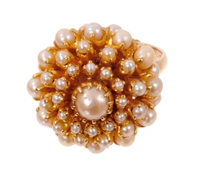 Lot 1982 - Cultured pearl cluster cocktail ring with a domed flower head cluster of cultured pearls in claw setting on yellow gold shank. Finger size approximately O.