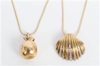 Lot 3290 - Gold (9ct) diamond set shell pendant on chain...