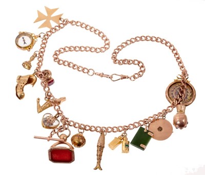 Lot 1989 - Gold charm necklace with a long length of 9ct rose gold curb links suspending a collection of 15 antique and vintage gold and yellow metal novelty charms, seals and fobs. Length approximately 67cm.