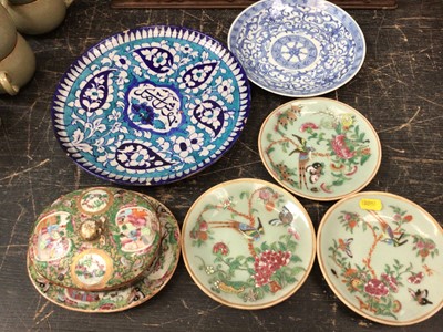 Lot 194 - 19th century Chinese famille rose porcelain butter dish and stand, together with three 19th century Chinese celadon dishes, a blue and white dish, and a Persian dish