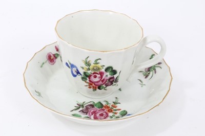 Lot 17 - Worcester faceted coffee cup and saucer, circa 1770, polychrome painted with flowers
