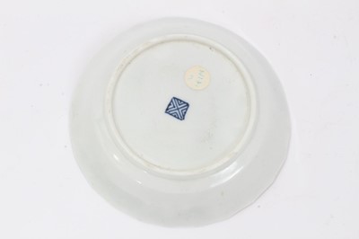 Lot 17 - Worcester faceted coffee cup and saucer, circa 1770, polychrome painted with flowers