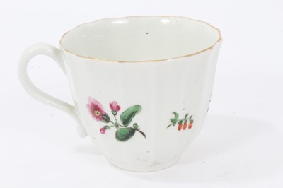 Lot 17 - Worcester faceted coffee cup and saucer, circa 1770, polychrome painted with flowers