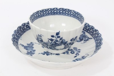Lot 27 - Caughley tea bowl and saucer, circa 1780, of fluted form, printed in blue with the 'Apple' pattern, the saucer measuring 12.75cm diameter