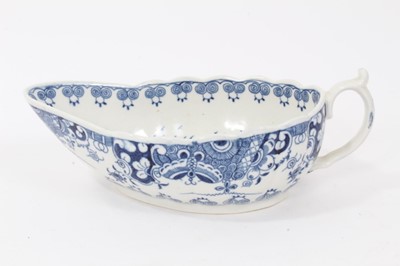 Lot 46 - Worcester sauceboat, circa 1770, painted in underglaze blue with the Doughnut Tree pattern, 18cm long