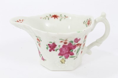 Lot 50 - Worcester cream boat, circa 1760, with hexagonal base, polychrome painted with flowers in the famille rose style, 5.75cm high