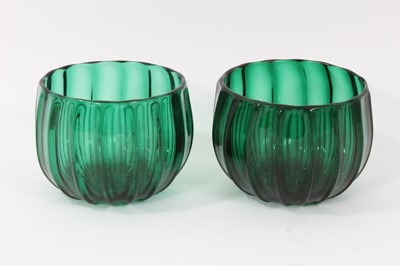 Lot 65 - Pair of green glass finger bowls, early 19th century, of moulded round shape with polished pontil marks, 9cm high