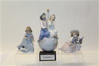Lot 1060 - Two Lladro porcelain figures - boy and girl...