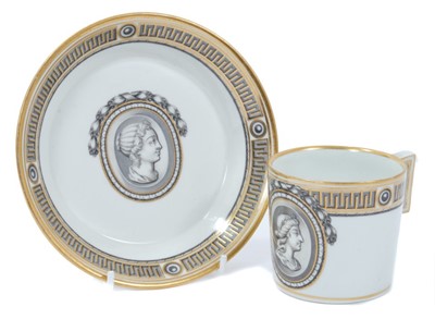 Lot 69 - Vienna coffee can and saucer, circa 1780, painted en grisaille with a portrait in profile, the edge with fret pattern, highlighted in gilt, underglaze blue marks to bases, the saucer measuring 13.5...