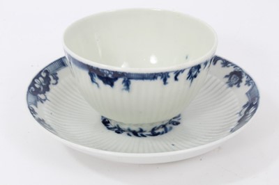 Lot 81 - Worcester blue and white fluted tea bowl and saucer, circa 1760, decorated with patterned borders, the saucer measuring 11.75cm diameter