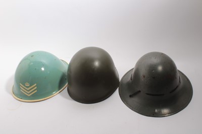 Lot 744 - American M1 pattern steel helmet with camouflage covering together with a Second World War British Zuckerman steel helmet and 5 other helmets (7)