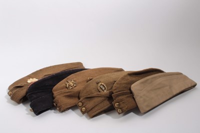 Lot 748 - Second World War British military side cap with Royal Corps of Signal cap badge, dated 1940 to interior, together with another also dated 1940 and four further side caps (6)