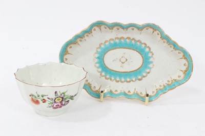 Lot 95 - Two 18th century Worcester items, including a spoon tray, of lozenge form, decorated in light blue and gilt, and a faceted tea bowl, polychrome painted with flowers