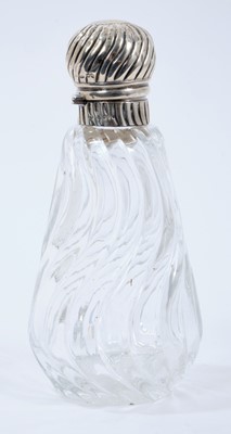 Lot 479 - Victorian wrythen pattern cut glass toilet bottle of conical form with silver hinged cover