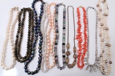 Lot 214 - Group of ten necklaces including pearls, green hard stone, cloisonné, paste set, coral and glass beads